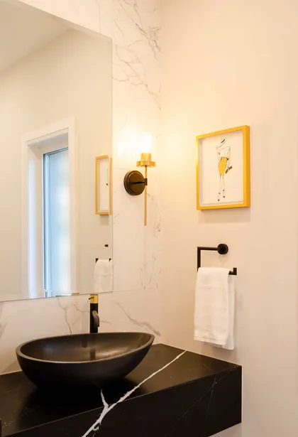 Chic Modern Bathroom Renovation with Gold Accents - Image 1
