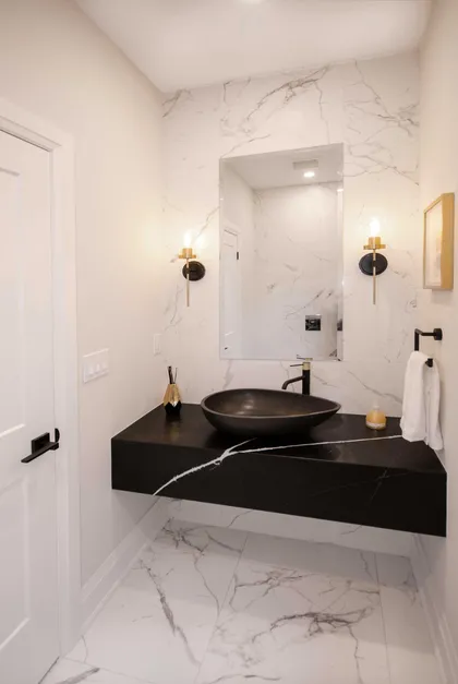 Chic Modern Bathroom Renovation with Gold Accents - Image 7