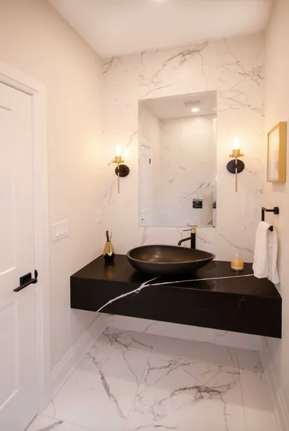 Chic Modern Bathroom Renovation with Gold Accents - Image 3