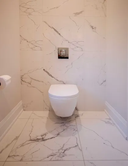 Chic Modern Bathroom Renovation with Gold Accents - Image 4