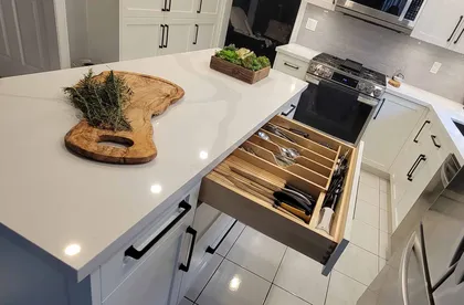 Compact Kitchen with Textured Backsplash - Image 3